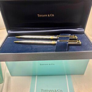 Tiffany & Co. T clip Gold plated and steel mechanical pen and pencil set.